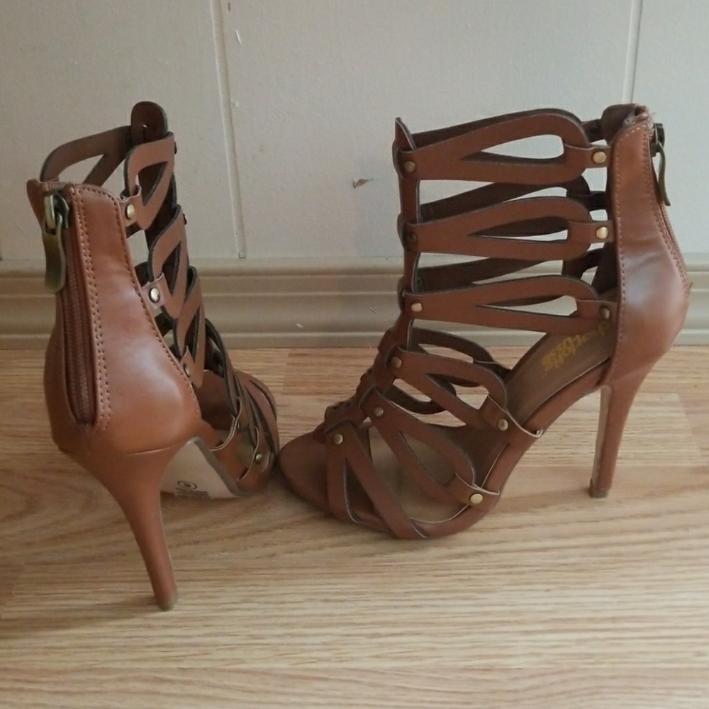 Brown, high heel sandals that were worn once